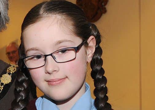 Keira Beeson pictured receiving her Rotary Club Children of Courage Award recently.