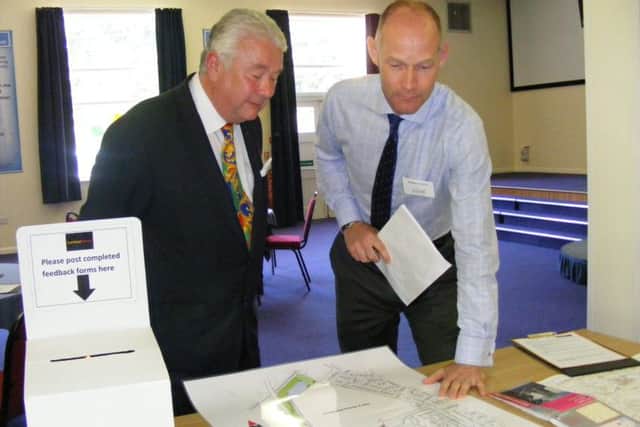 Sleaford councillor Adrian Snookes chats to Edward Saunders from Athene Communications about the Larkfleet Homes plans. EMN-160905-175327001