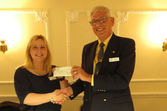 Hospice representative ZaZa Warren receiving the cheque from Probus chairman Bob Aspinall EMN-160513-163156001