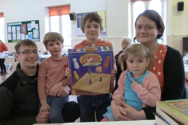 The Mannion family, from left David, William, Edward, Kathy and Aliena with the Snakes and Ladder game they purchased at Caistor Methodist fair. (Lin) EMN-160522-191929001