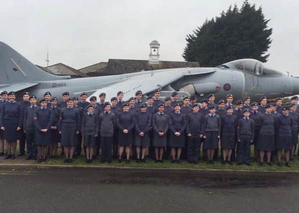 Cadets in front of the Harrier gate guardian at RAF Wittering EMN-160522-225608001
