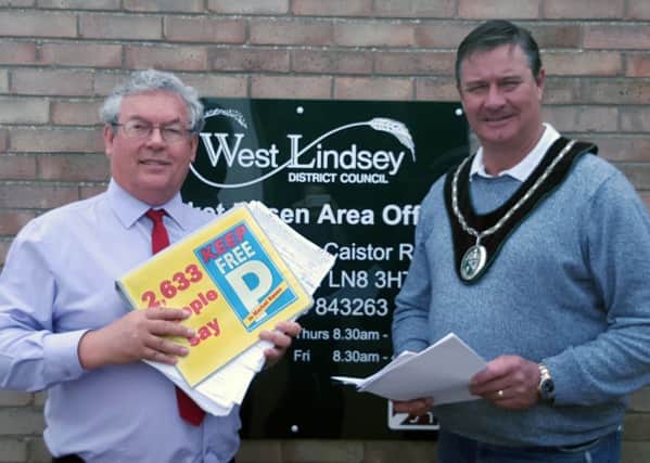 Petition with 2,633 names opposing car park charges in Market Rasen is presented to WLDC by local businessman Adrian Campbell and town Mayor John Matthews. EMN-160520-150104001