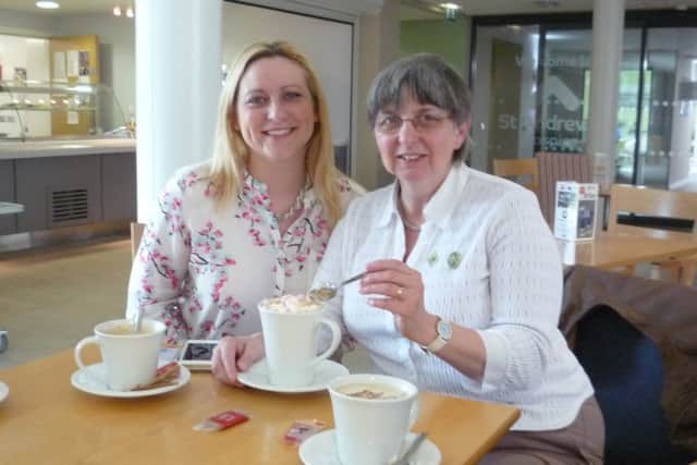 Hilary Harris and ZaZa Warren enjoying hot chocolate with all the trimmings at the Hospice hub. EMN-160519-141618001