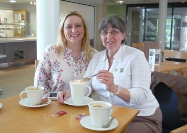 Hilary Harris and ZaZa Warren enjoying hot chocolate with all the trimmings at the Hospice hub. EMN-160519-141618001
