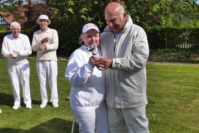 Pauline Donner receiving the Lincoln Singles Cup from chairman Bob Potter. Onlookers are Roy Donner and Ralph Timms who finished third and second respectively.
