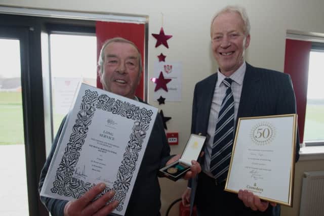 Terry Taylor, left, receiving his long-service award.
Photo by Steve Smailes Photography. All rights reserved. EMN-160517-090501001
