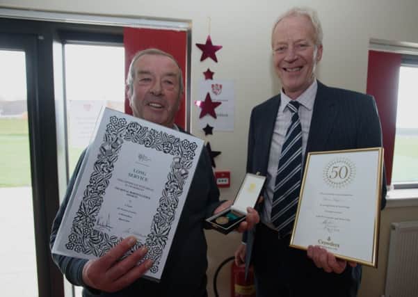 Terry Taylor, left, receiving his long-service award.
Photo by Steve Smailes Photography. All rights reserved. EMN-160517-090501001
