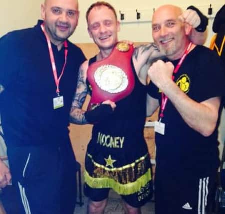 Matthew Mooney celebrates his title.