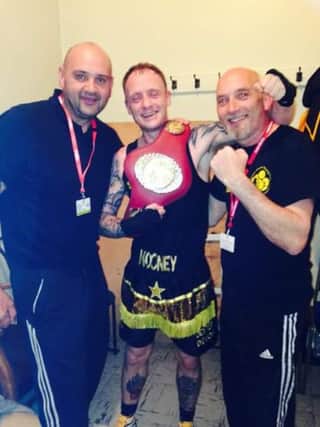 Matthew Mooney celebrates his title.