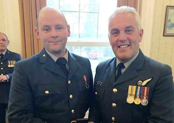 Louth officer Carl Johnson (left) recently received the Cadets Forces Medal.