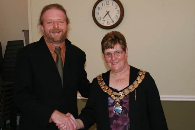 New Brigg Town Mayor Coun Ann Eardley receives the mayoral chain from retiring Town Mayor James Truepenny EMN-160525-233120001