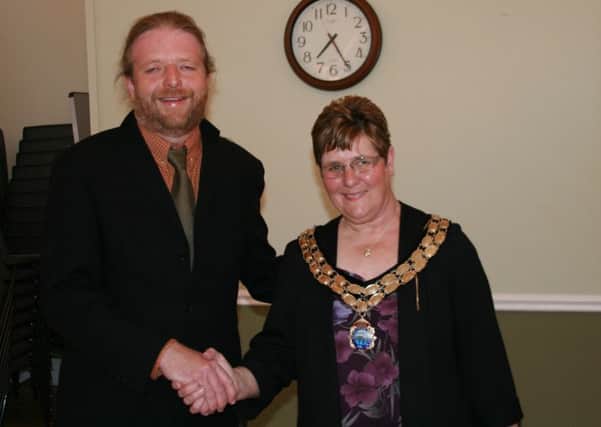 New Brigg Town Mayor Coun Ann Eardley receives the mayoral chain from retiring Town Mayor James Truepenny EMN-160525-233120001
