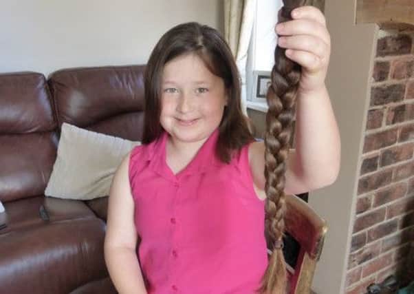 Daisy Mills has cut off her long locks to help children with cancer EMN-160524-130600001