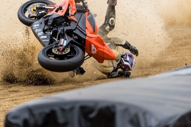 Aaron Clarke crashes out. Photo: Barry Clay.
