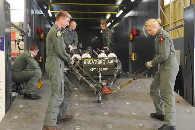 45(Reserve) Squadron media event at RAF Cranwell. Weapons Systems Operators loading/unloading a simulated fixed wing aircraft. EMN-160524-105718001