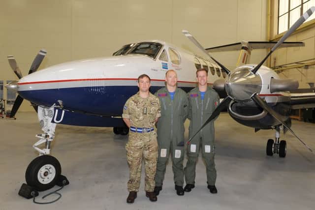 45(Reserve) Squadron media event at RAF Cranwell. L-R Captain Gareth Binding - army air corp, Flt Lt Rob Grocock, Flt Lt Joe Munro, pictured with a Kingaair B200 GT. EMN-160524-105949001