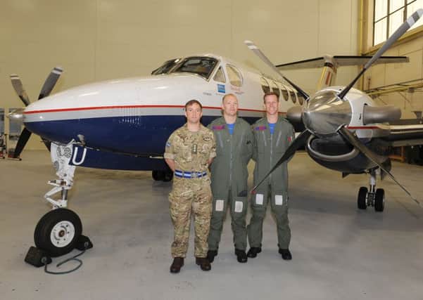 45(Reserve) Squadron media event at RAF Cranwell. L-R Captain Gareth Binding - army air corp, Flt Lt Rob Grocock, Flt Lt Joe Munro, pictured with a Kingaair B200 GT. EMN-160524-105949001