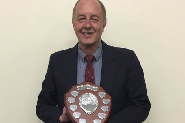 Richard Walker with the Sally Walker Shield for Player Personality. ANL-160524-130427001