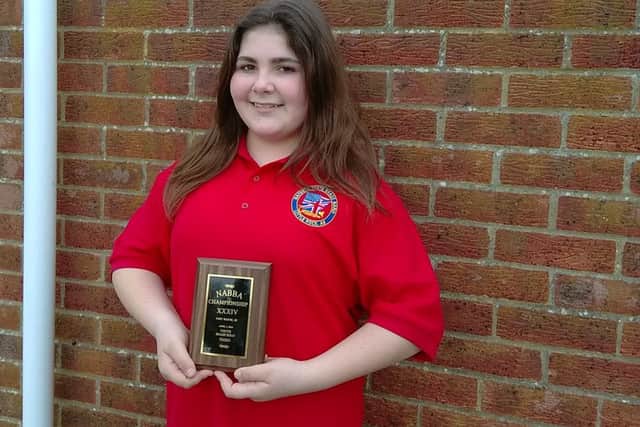 Kira Roberts with the Edward Robinson Cup for Musical Progress.. ANL-160524-130537001