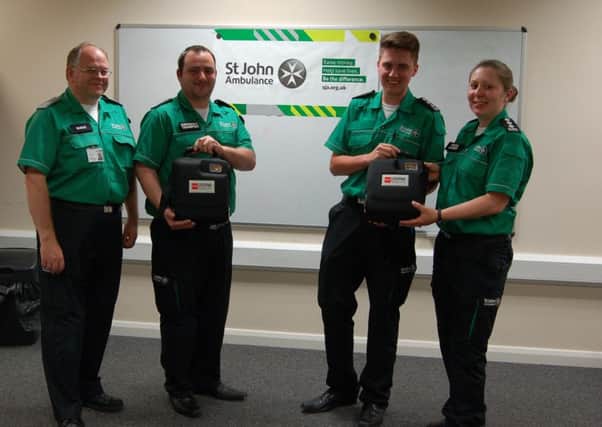 Peter Howie, John Dawson, Jordan Herd and Lisa Sanguy from St John Ambulance with the new defibrillator.