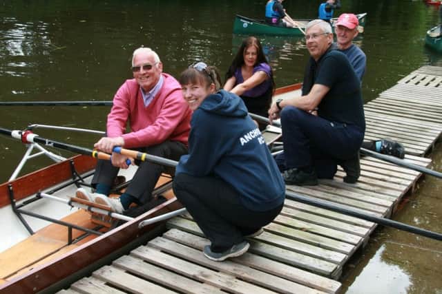 Mike Youngman (left) and Shelley Youngman (in boat) try out rowing at the Ancholme Rowing Club under the watchful eyes of, from left, Club Captain Zoe Sparling, Vice Chairman Jim Copson and Andrew Spellman. EMN-160106-114344001