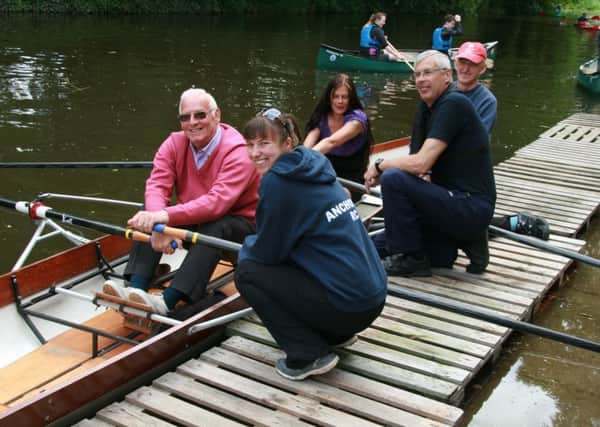 Mike Youngman (left) and Shelley Youngman (in boat) try out rowing at the Ancholme Rowing Club under the watchful eyes of, from left, Club Captain Zoe Sparling, Vice Chairman Jim Copson and Andrew Spellman. EMN-160106-114344001