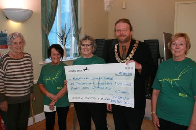 Brigg's outgoing mayor, James Truepenny presented the cheque to Gerry Hartley, Anne Bush, Barbara White and Kathryn Gardner from the Brigg area Macmillan fundraising group. EMN-160106-113839001
