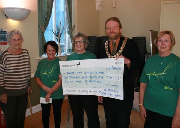 Brigg's outgoing mayor, James Truepenny presented the cheque to Gerry Hartley, Anne Bush, Barbara White and Kathryn Gardner from the Brigg area Macmillan fundraising group. EMN-160106-113839001