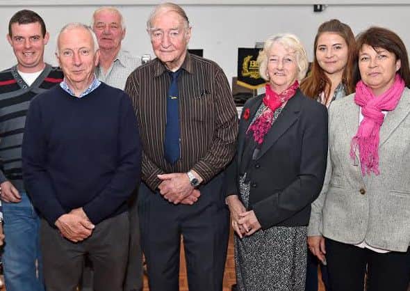 One hundred years on: John Tyblewski (centres) with members of the Belton family a the meorial service. EMN-160606-144257001
