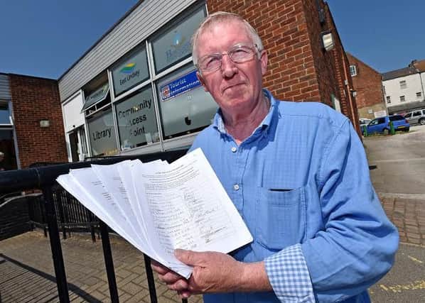 Bill Anderson with the petition outside the Horncastle CAP EMN-160606-121251001