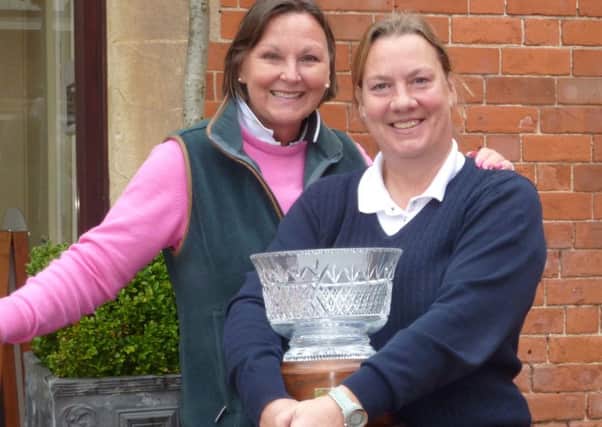 Kenwick Park ladies captain Penny Buckley (left) with Champ de Bataille winner Tracey Stobart EMN-160306-105350002