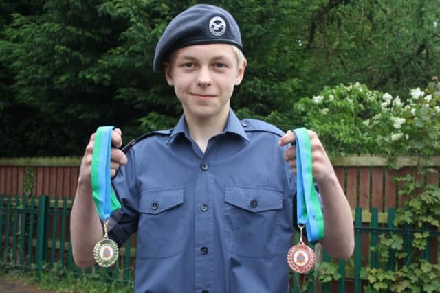 Cadet James Dowman with his medals EMN-160706-132358001