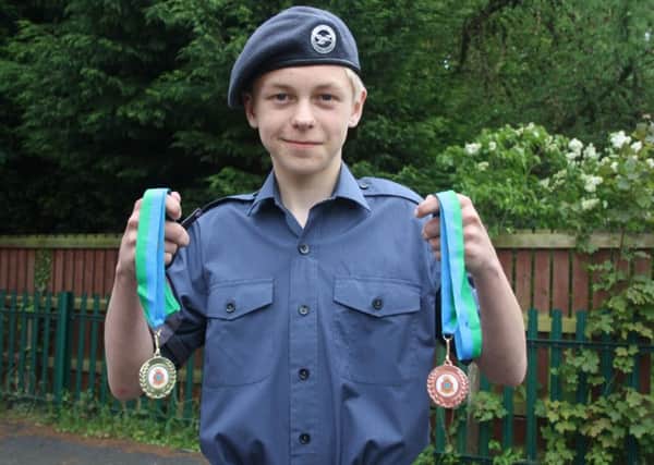 Cadet James Dowman with his medals EMN-160706-132358001