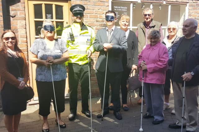 Blindfolded, from left: Coun Sue Ransome, Insp Andy Morrice, Coun Martin Griggs. Far right, Roger Fixter, third from right, Molly Fixter.