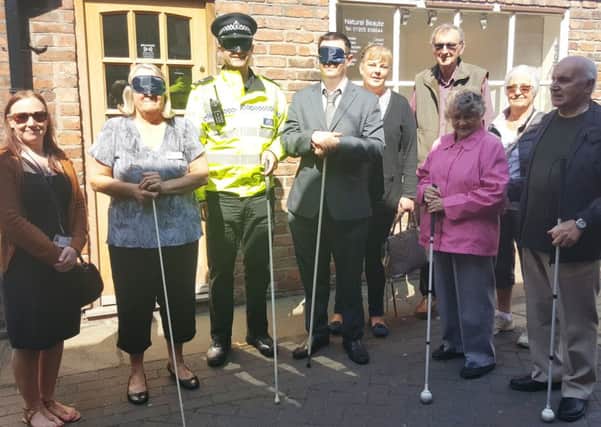 Blindfolded, from left: Coun Sue Ransome, Insp Andy Morrice, Coun Martin Griggs. Far right, Roger Fixter, third from right, Molly Fixter.