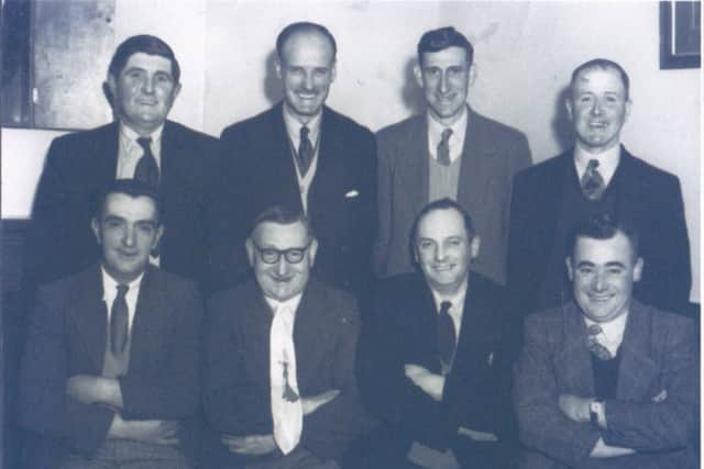 Ray Rushby (back left) and one of his pub darts teams. EMN-160606-105444001