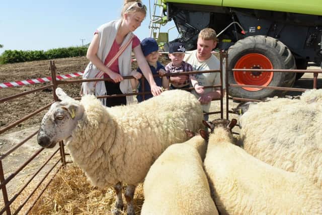 Open Farm Sunday event at Ewerby Thorpe.Jamie Paterson and Katie Barkey with Max Paterson 6 and William Paterson 3 of Sleaford. EMN-160606-152257001