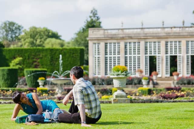 Visitors in the Italian Garden at Belton House, Lincolnshire. ENGEMN00120130417190149