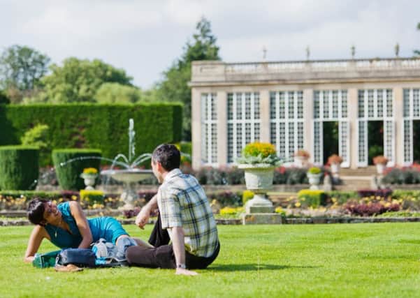 Visitors in the Italian Garden at Belton House, Lincolnshire. ENGEMN00120130417190149