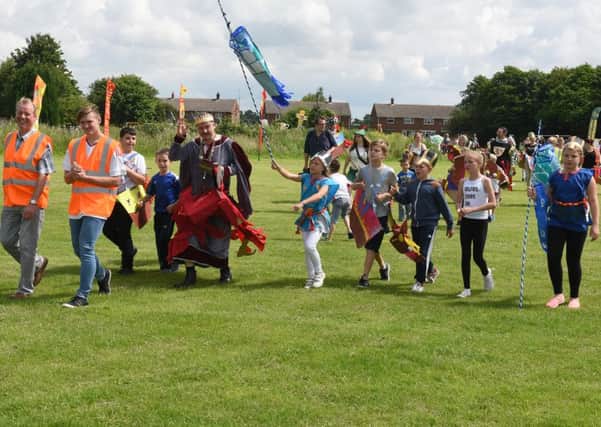 Medievel pageant at Swineshead. Parade arriving back at the Playing Fields.