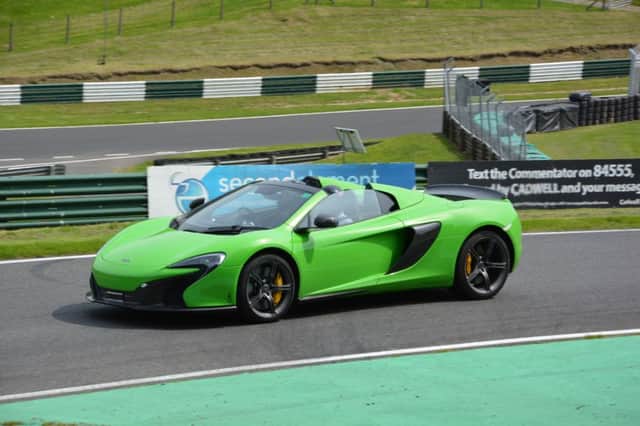 Andy Willison from Southampton took onlookers for rides around Cadwell Park in his McLaren 650S, including reporter Chrissie Redford. ANL-160620-171809001