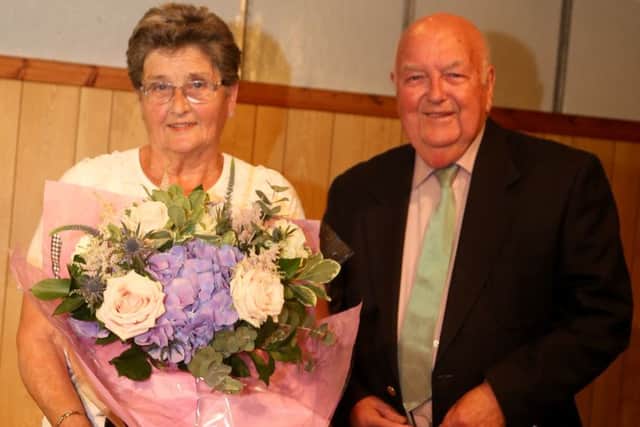 Charles and Joyce Hill were presented with an engraved Bible EMN-160616-221945001