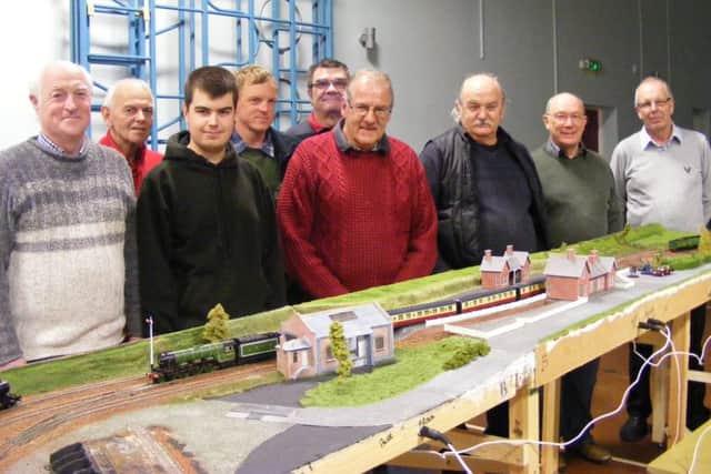 Members of Sleaford Model Railway Club with their latest lay-out. EMN-161006-172804001