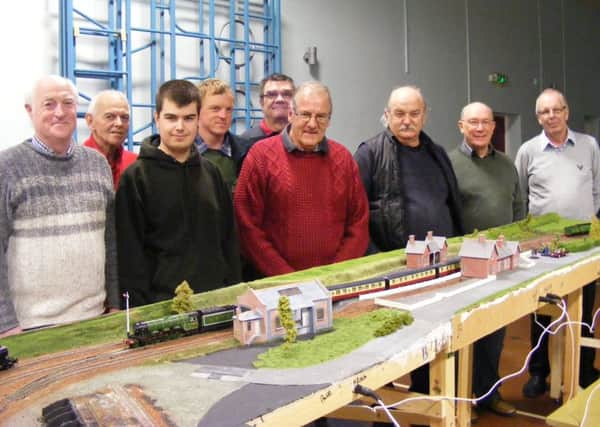 Members of Sleaford Model Railway Club with their latest lay-out. EMN-161006-172804001