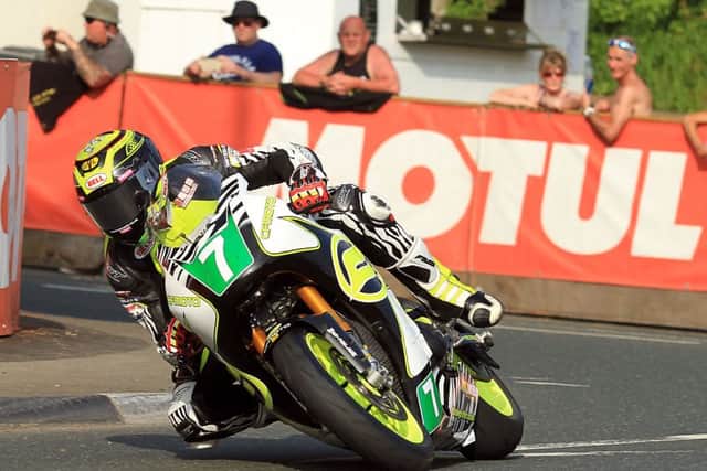Johnson rides to fourth place in the lightweight class at the Isle of Man TT Picture: Peter Bull EMN-160613-101025002