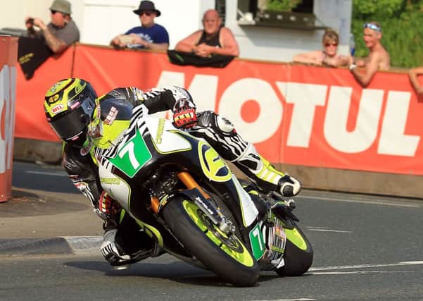 Johnson rides to fourth place in the lightweight class at the Isle of Man TT Picture: Peter Bull EMN-160613-101025002