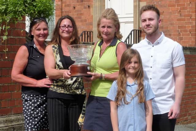Kenwick Park lady captain Penny Buckley with Claire Steele, Sue Fisher, Ellie and Euan Steele EMN-160613-150637002