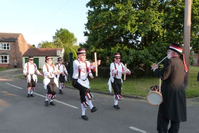 The Grimsby Morris Men performing a dance at North Kelsey. (Photo by Linda Oxley) EMN-160616-065701001
