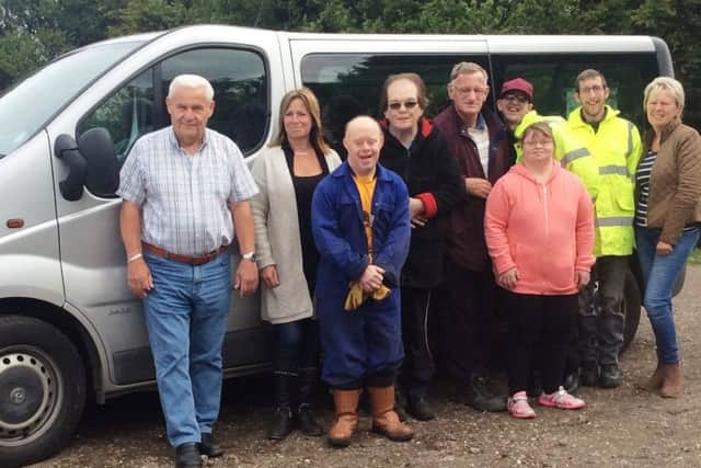 Thistles staff and students with their new minibus and driver Roger Curtis (left).