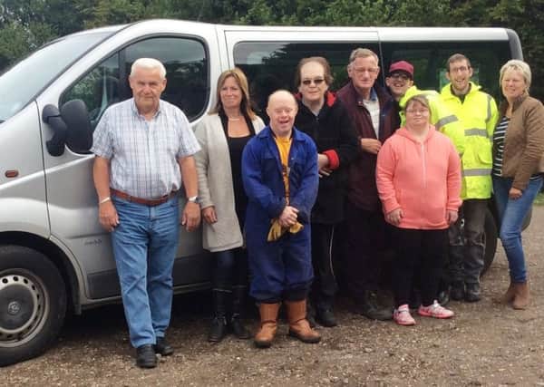 Thistles staff and students with their new minibus and driver Roger Curtis (left).